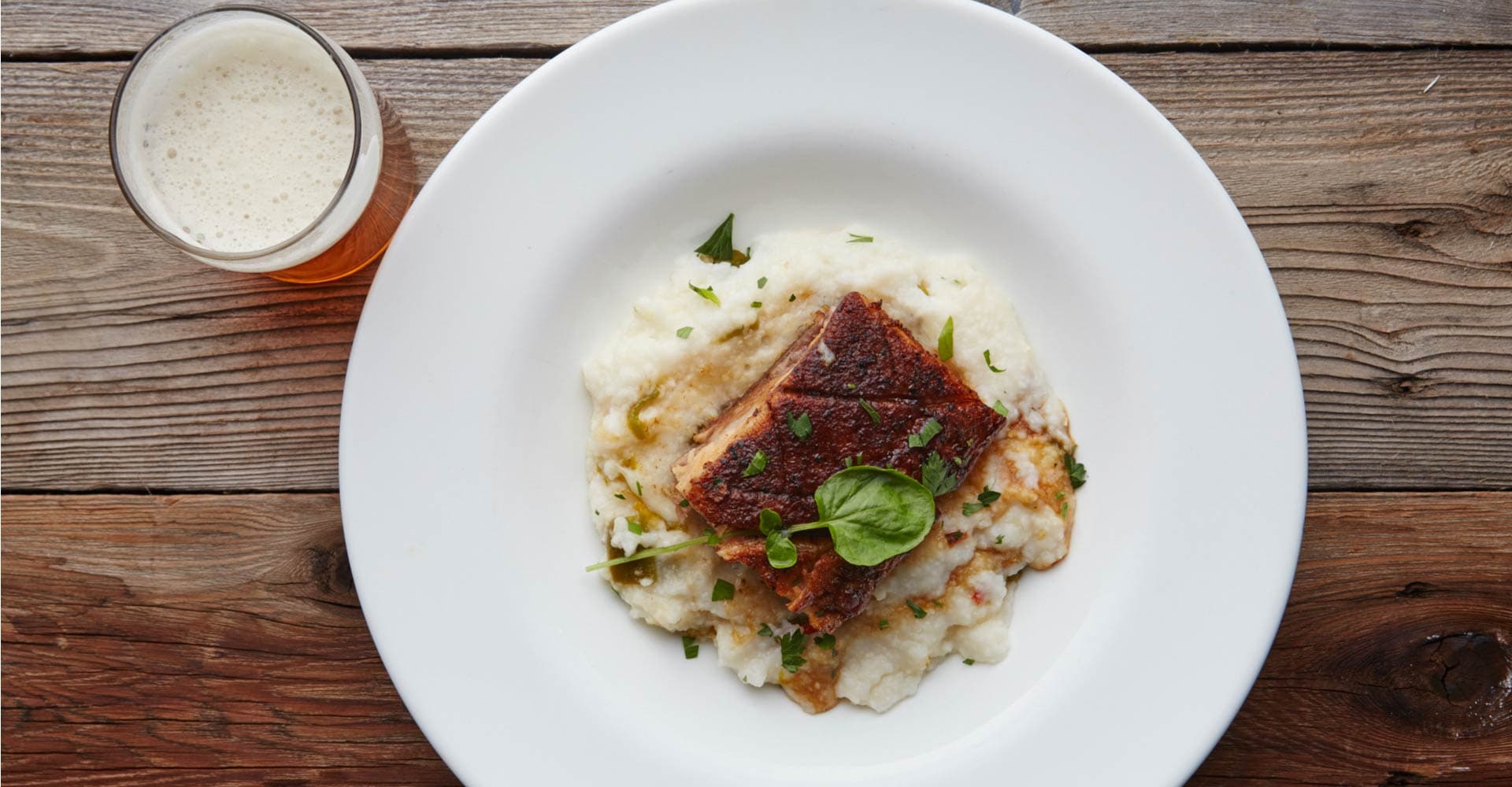 Beer-Braised Pork Belly with Green Chili White Cheddar Grits Recipe